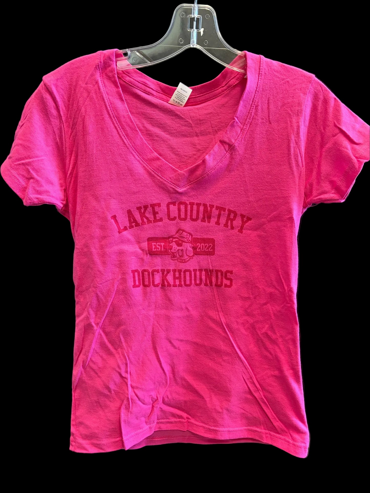Pink t-shirt with 'Lake Country Dockhounds' text on a hanger.