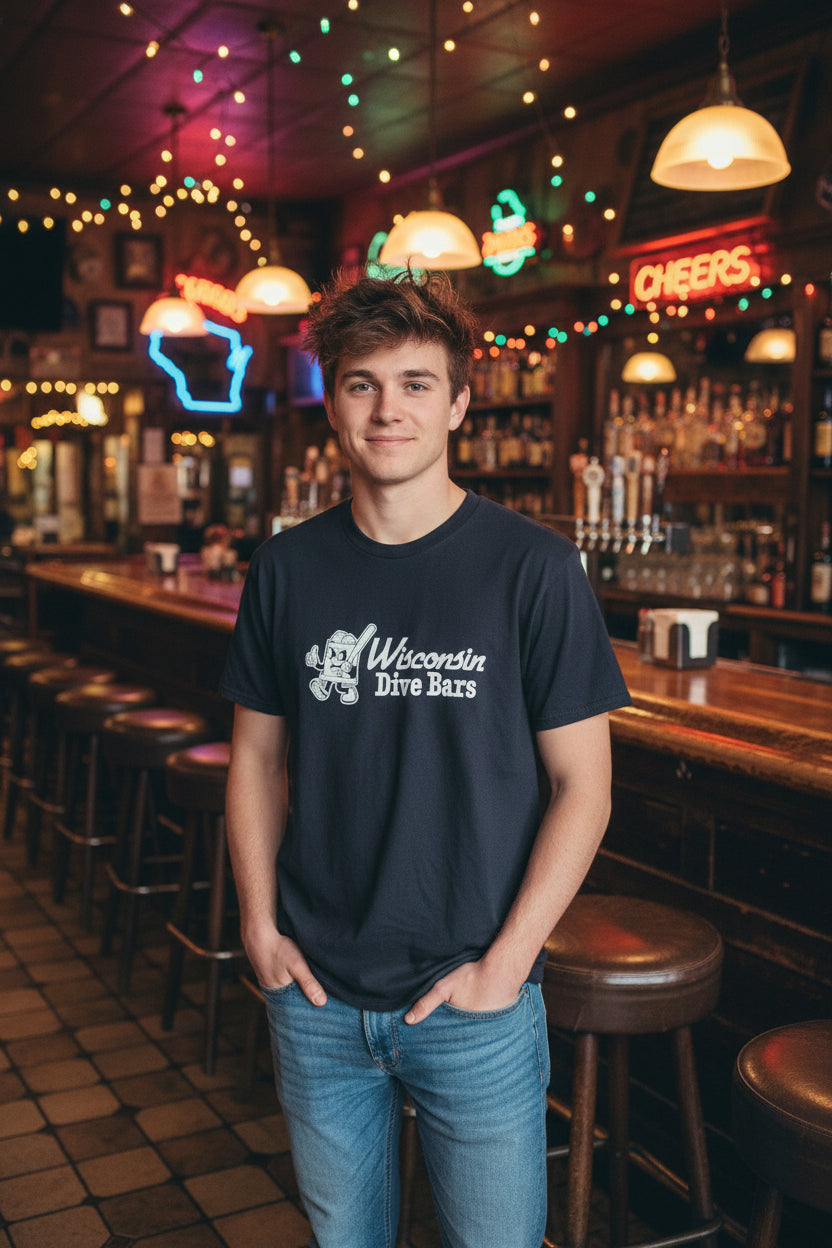 Black t-shirt with 'Wisconsin Dive Bars' text on a hanger in a store setting.